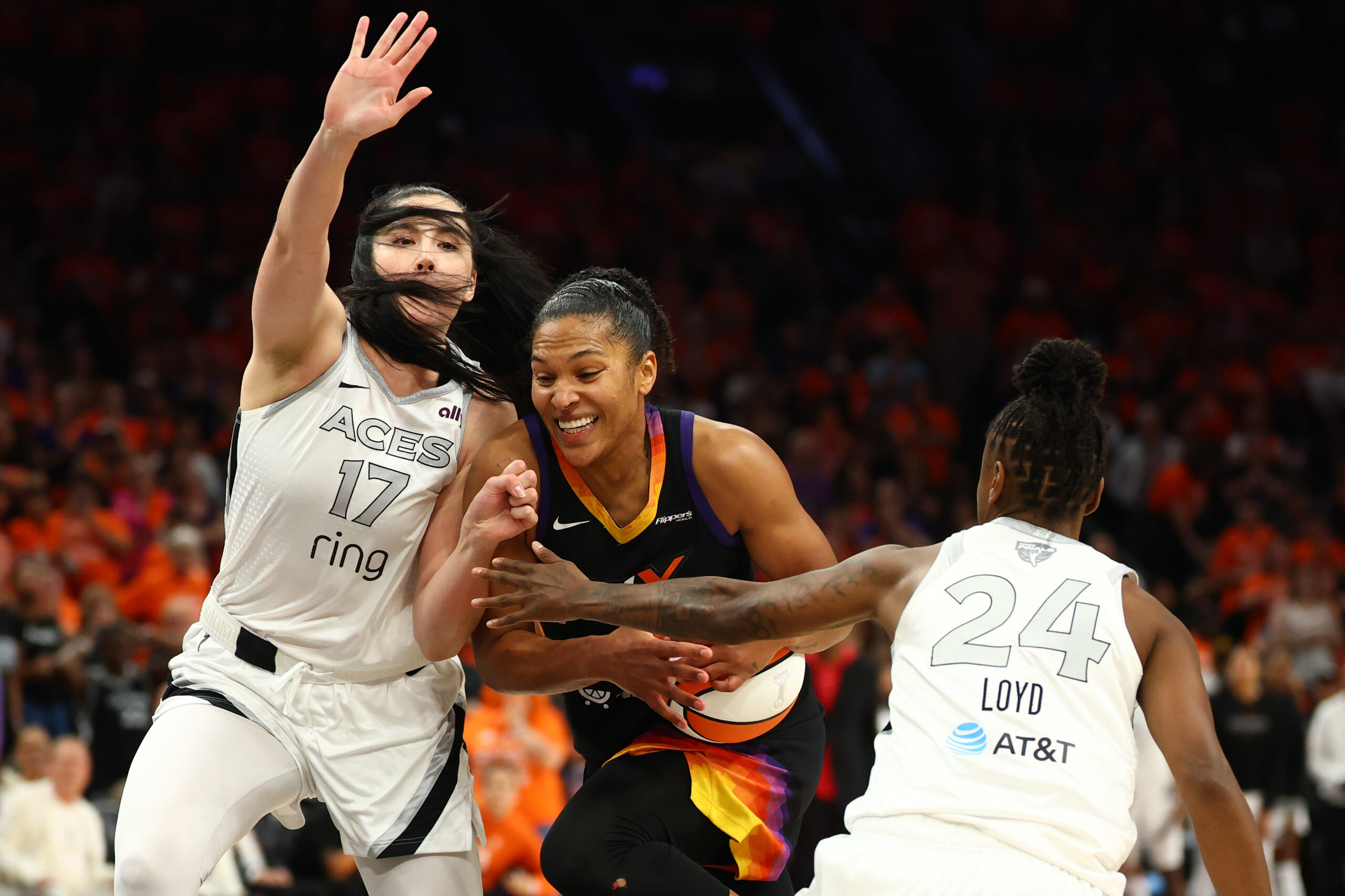 Alyssa Thomas drives to the basket on Megan Gustafson before attempting what would've been a go-ahead shot in the game's final seconds.