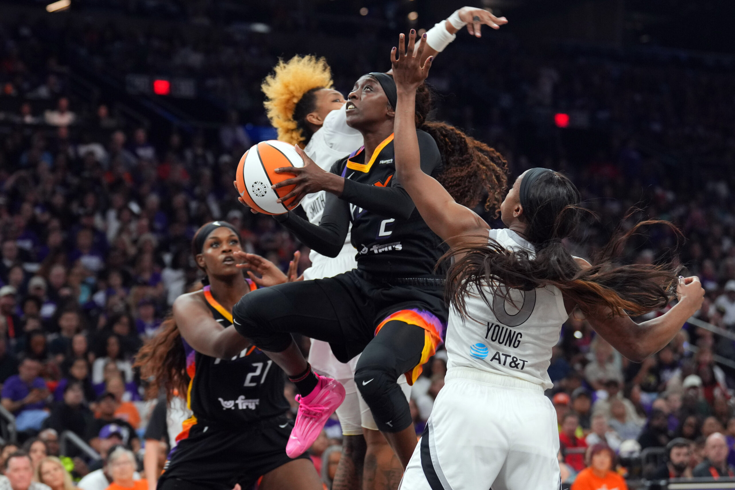 Mercury guard Kahleah Copper attempts a layup between two Aces defenders suring Game 4 of the WNBA Finals.