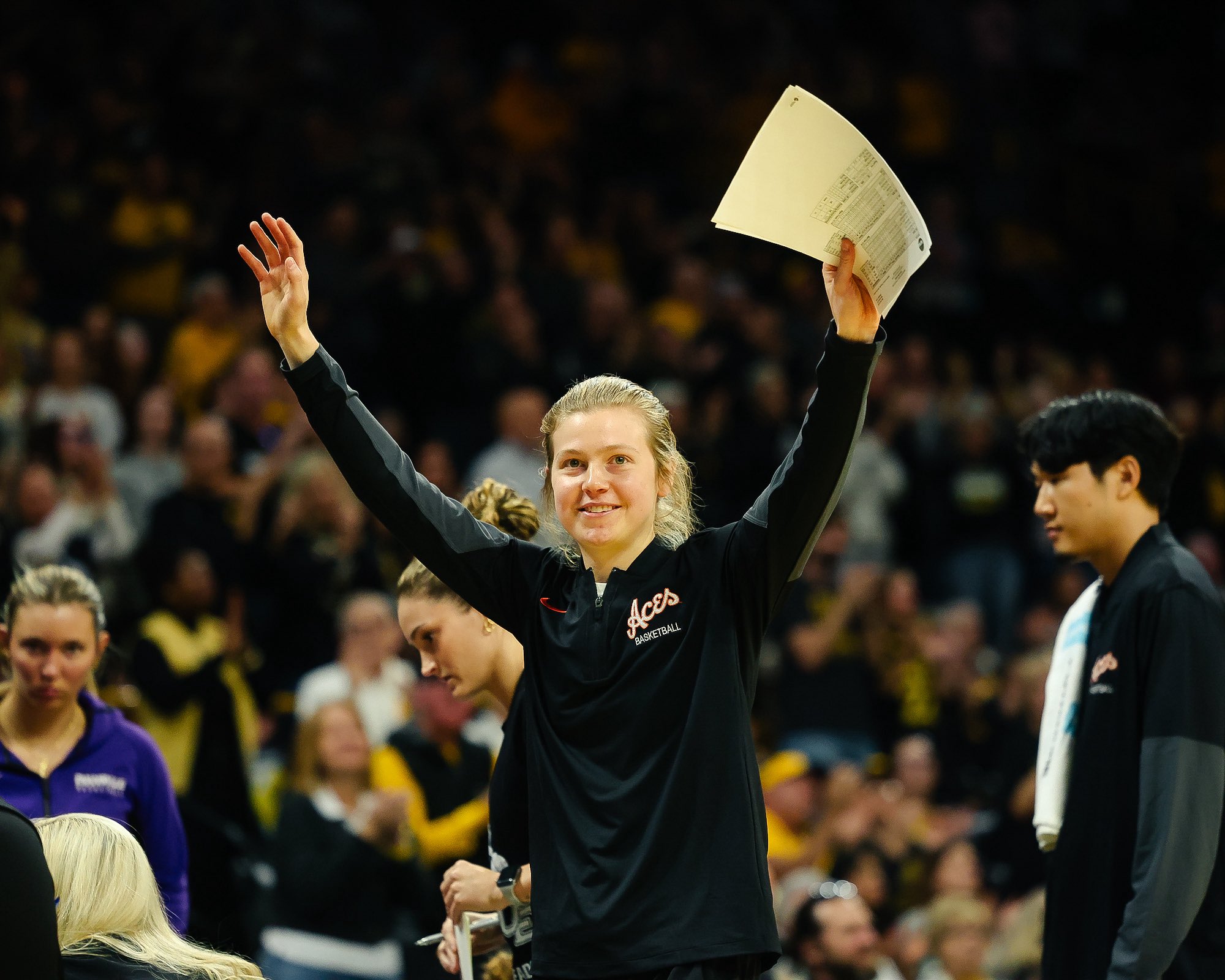 Molly Davis waves to the crowd at Carver-Hawkeye Arena in Iowa City, IA.