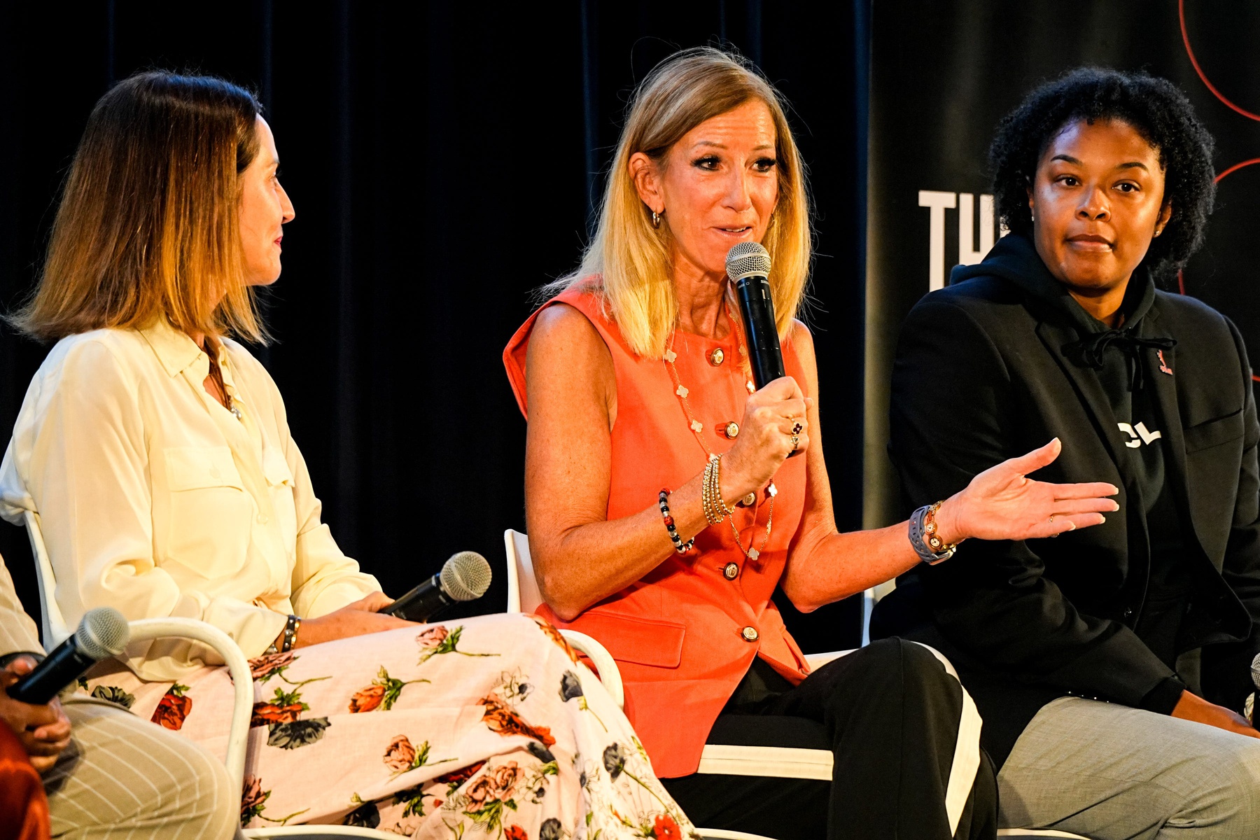 WNBA Commissioner Cathy Engelbert with a microphone.
