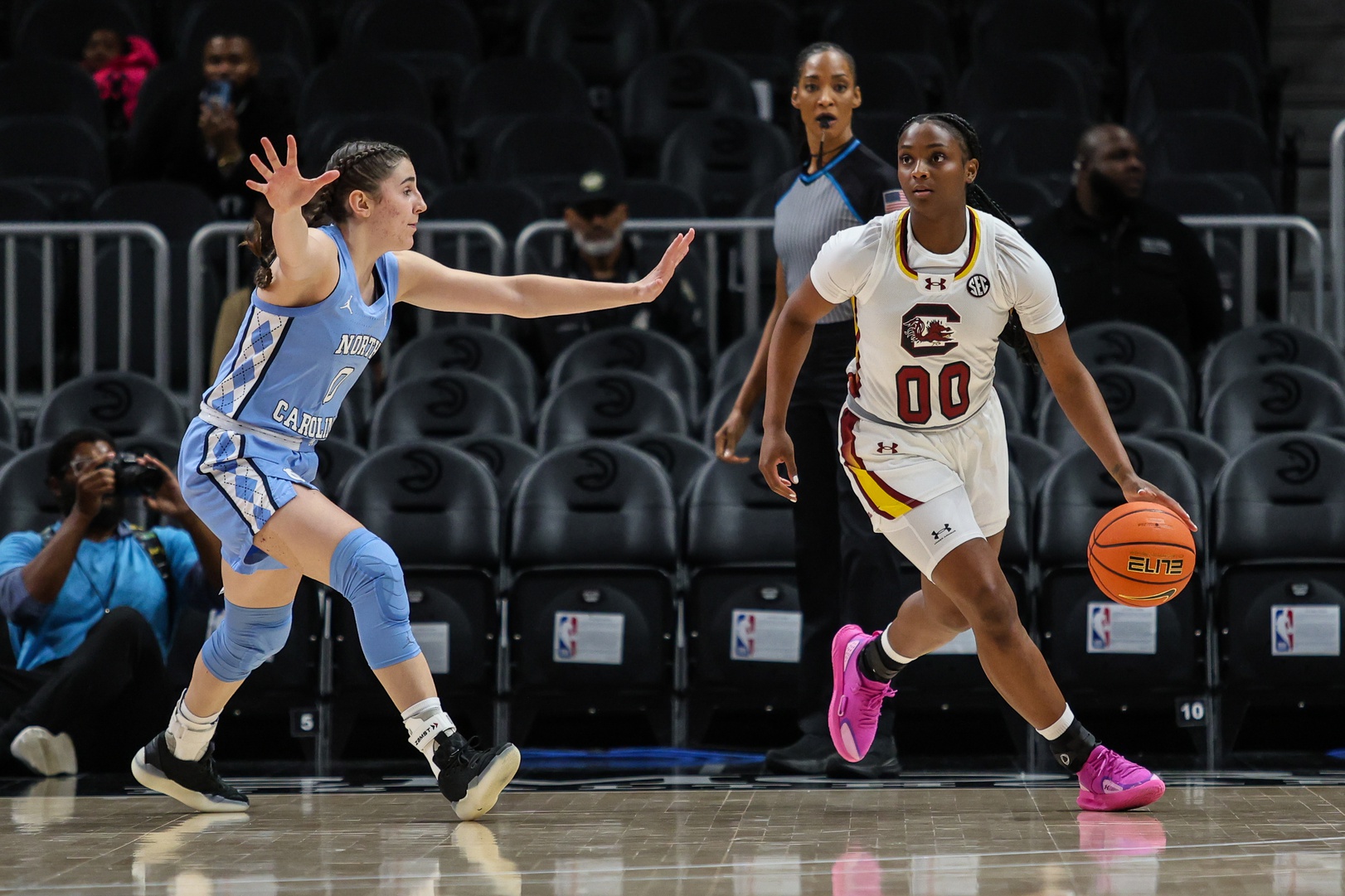 Ta'Niya Latson dribbles.