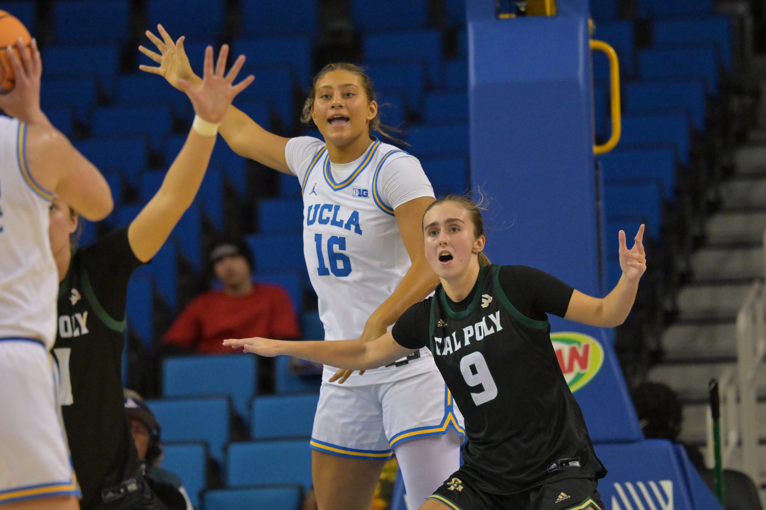 UCLA freshman forward Sienna Betts calls for the ball while being defended by Cal Poly forward Nora Perez