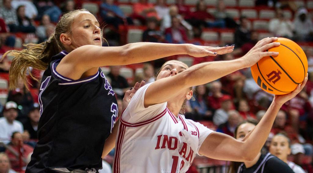 Indiana player Shay Ciezki shoots over a defender during a recent game in Bloomington, IN.