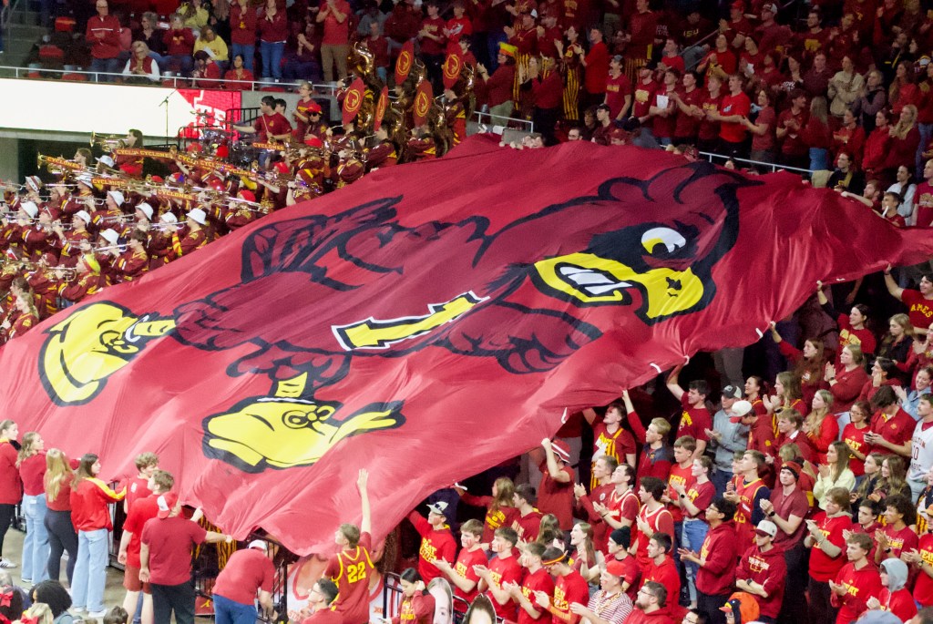 The Iowa State student section waves the Cyclone flag during the Cyclones' 74-69 win over Iowa on Dec. 10, 2025, at Hilton Coliseum in Ames, Iowa.