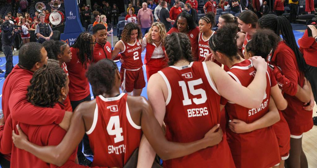 Oklahoma women's basketball celebrates their win over rival Oklahoma State on Dec. 13 with a team huddle at Paycom Arena in Oklahoma City, OK.