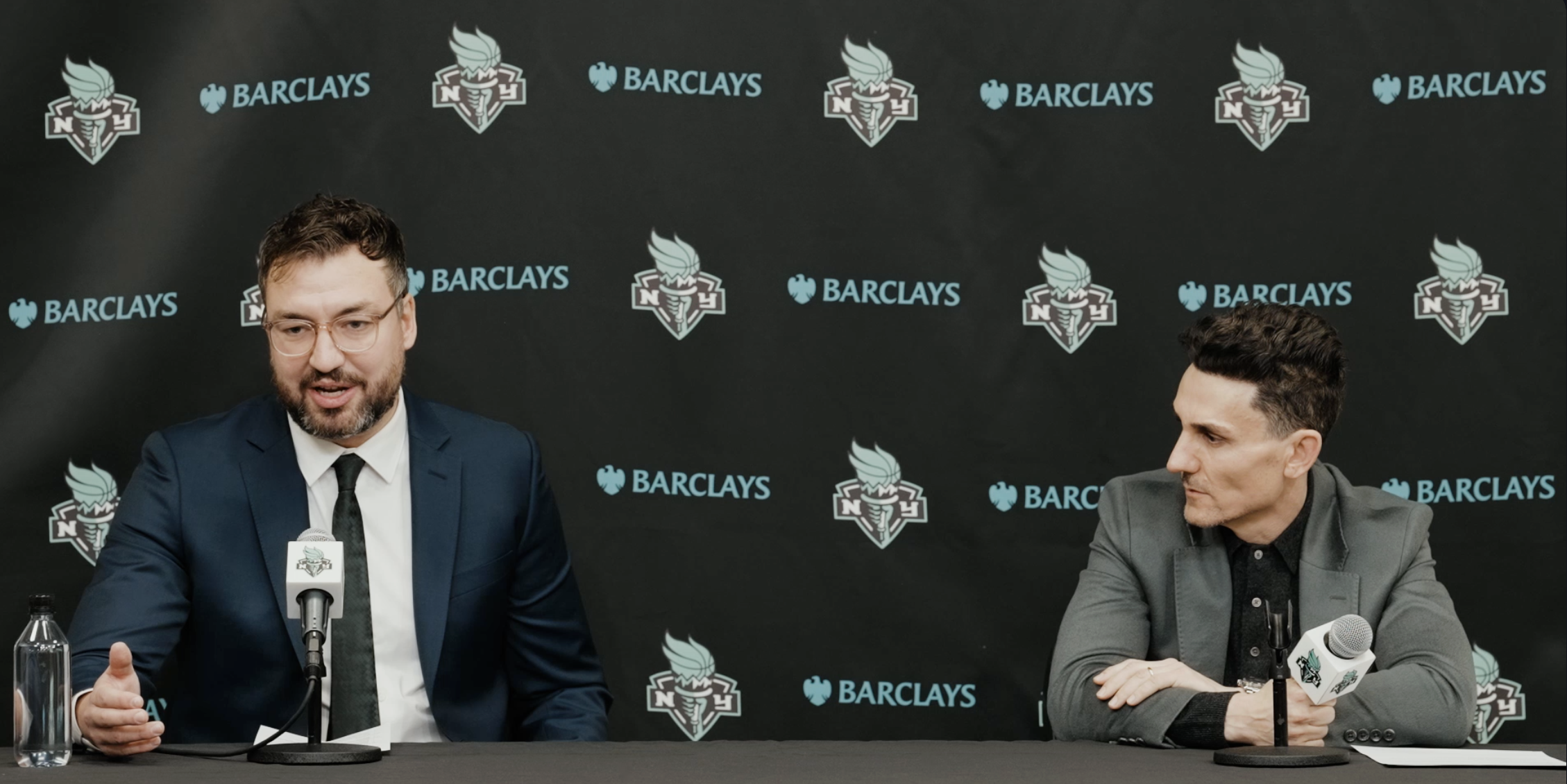 Chris DeMarco and Jonathan Kolb, speaking at the podium.