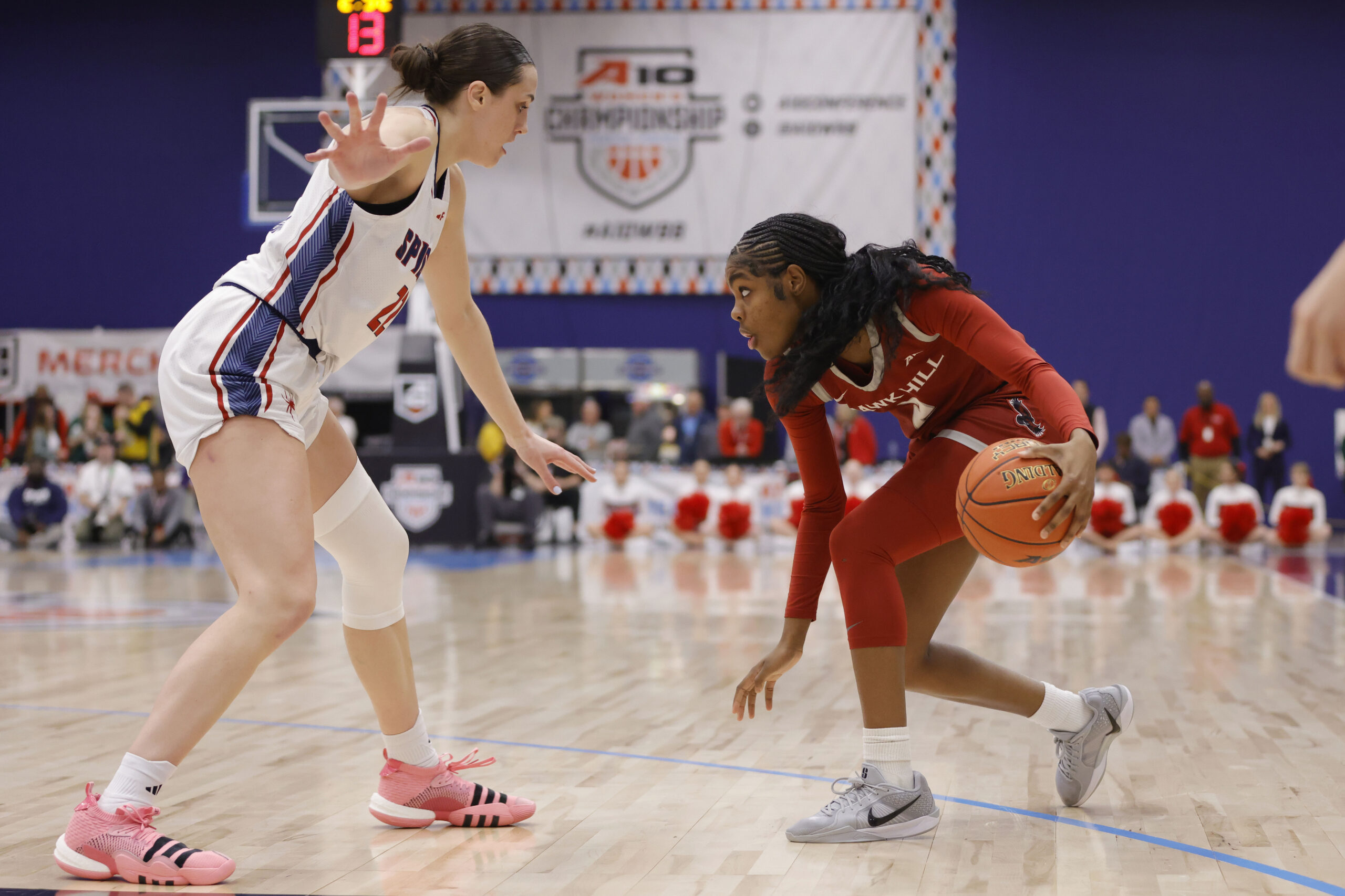 Saint Joseph's Hawks guard Aleah Snead (2) controls the ball against a Richmond defender