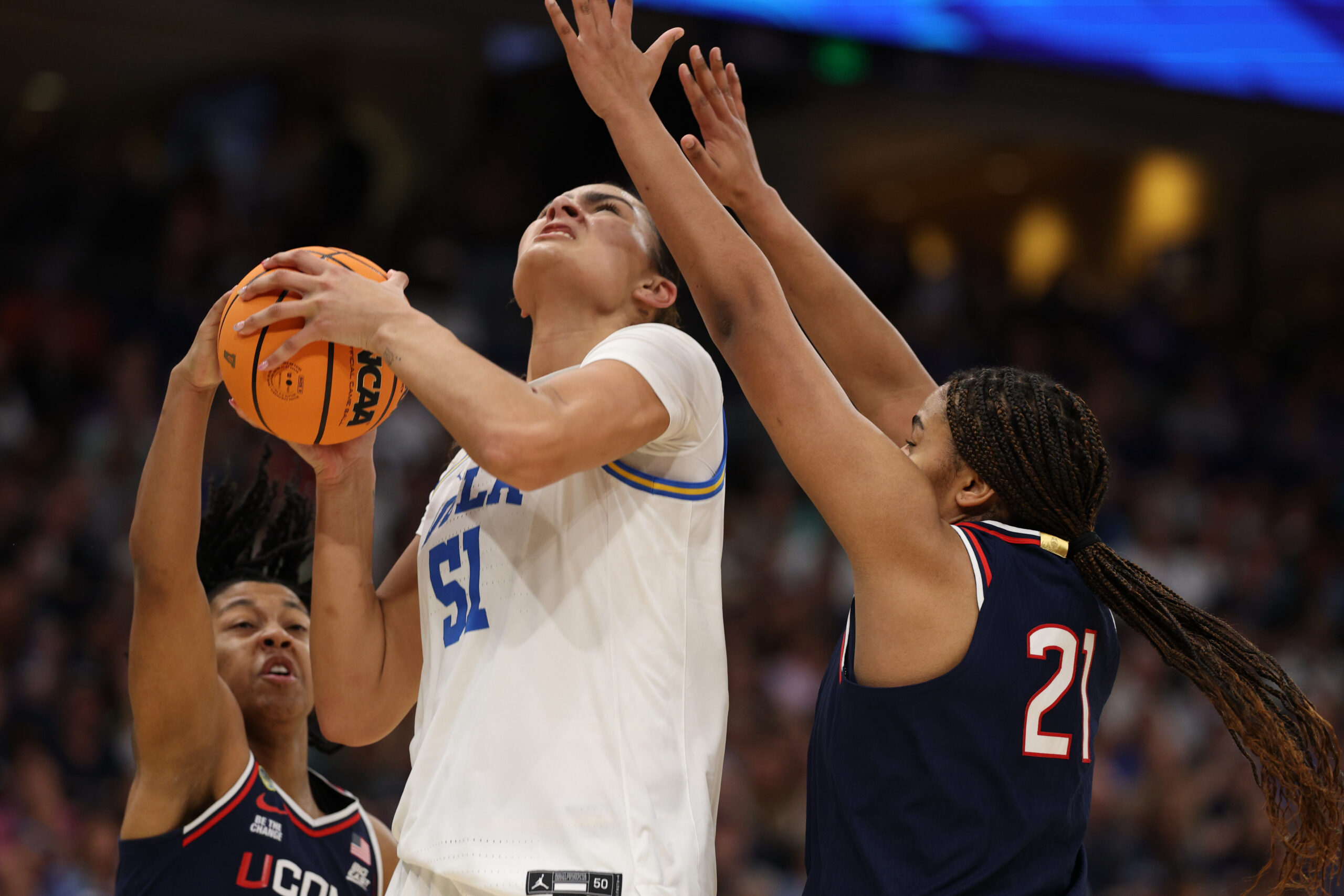 Lauren Betts attempts a shot against a double team of UConn players in last year's Final Four.