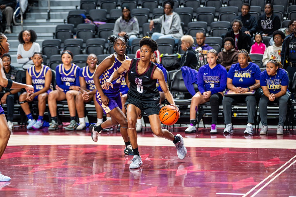 Alabama A&M's Rakiyah Beal drives the basket in a game against Alcorn State.