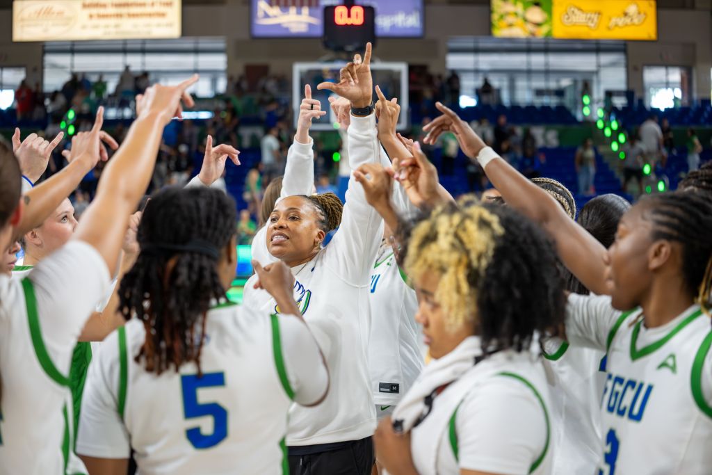Florida Gulf Coast University head coach Raina Harmon pumps up her team before their game against South Carolina.
