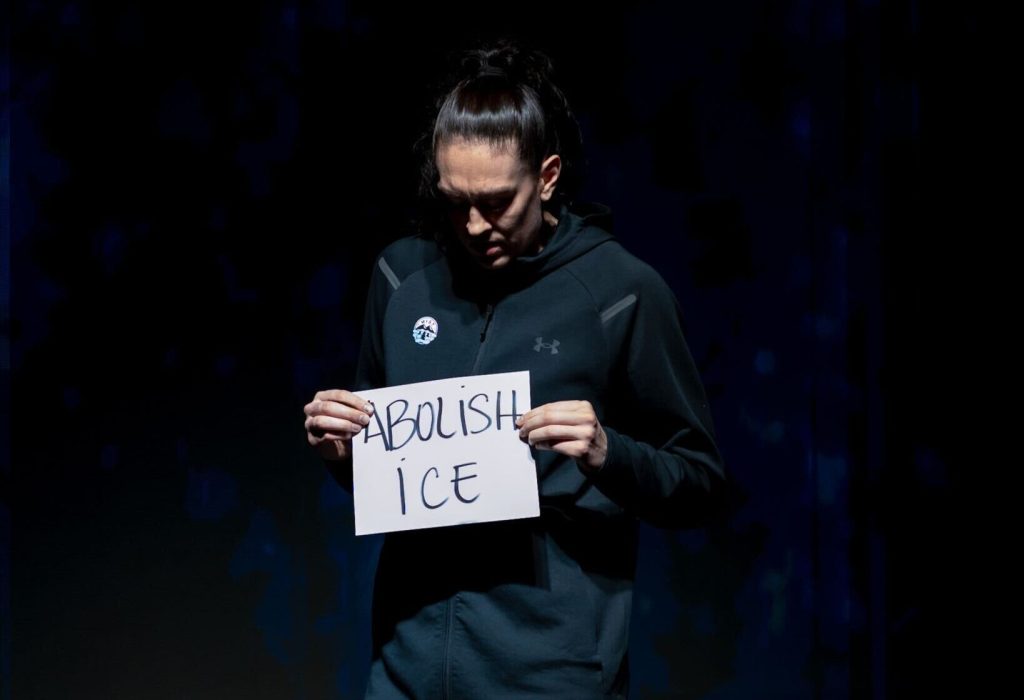 Liberty forward Breanna Stewart holds up a sign calling to abolish ICE on Sunday, Jan. 25 prior to an Unrivaled game.