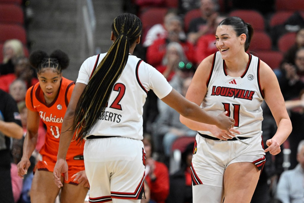 Louisville women's basketball players celebrate during their recent game against Virginia Tech.