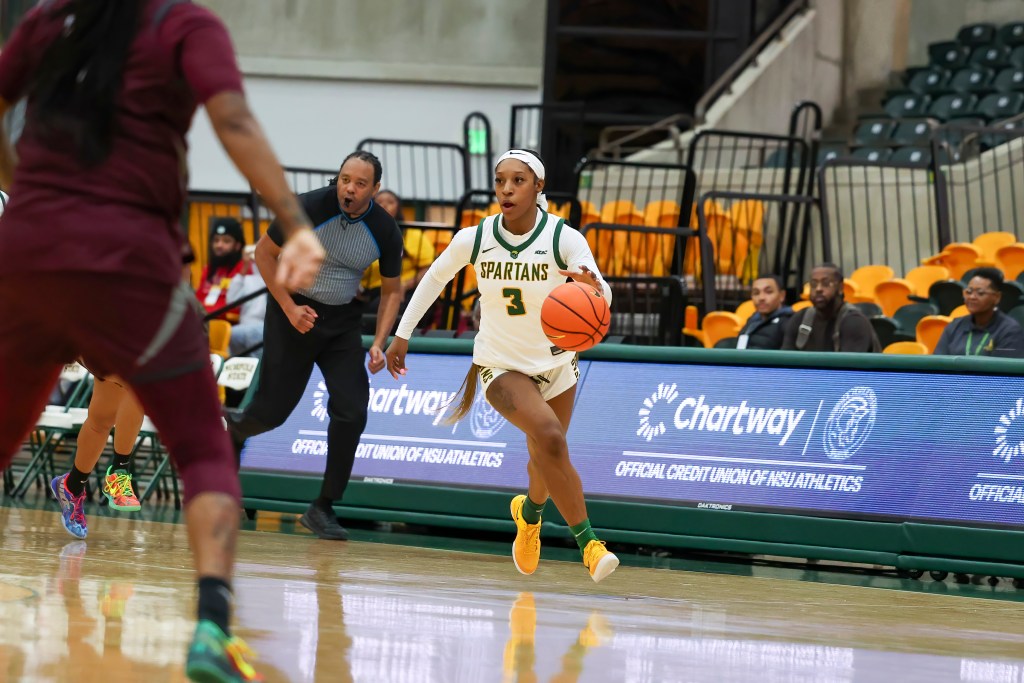 Norfolk State's Jasha Clinton dribbles the ball on a fast break in a home game.