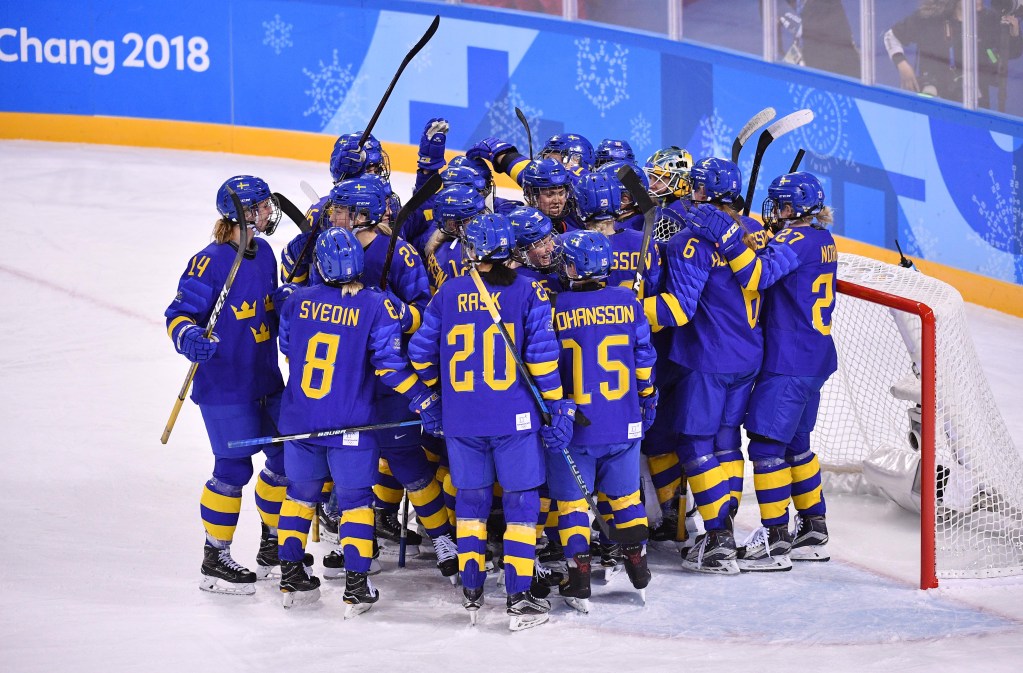 Sweden goaltender Sara Grahn (1) celebrates with teammates after defeating Japan during the Pyeongchang 2018 Winter Olympics.