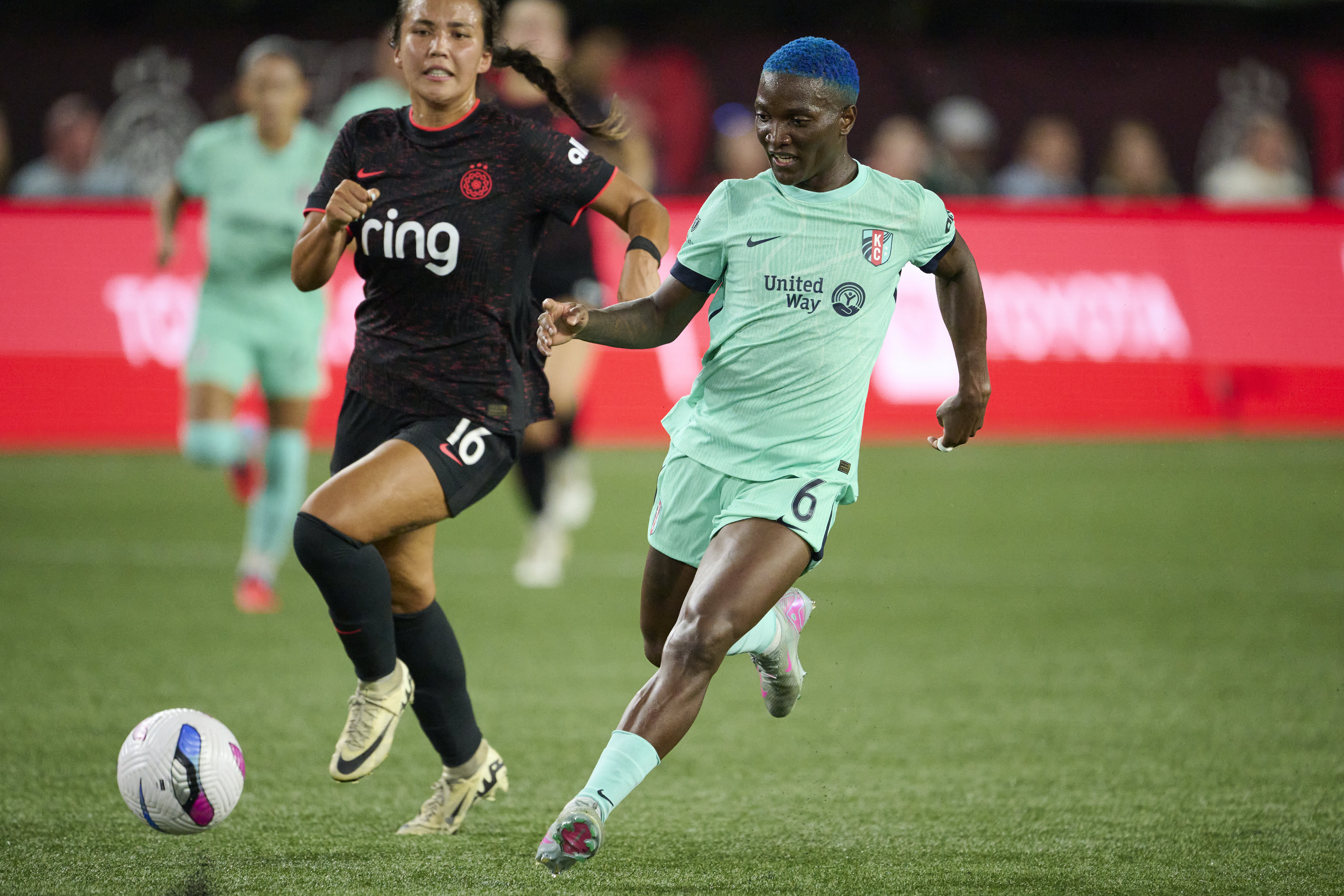 Kansas City Current forward Temwa Chawinga controls the ball in front of a defender.