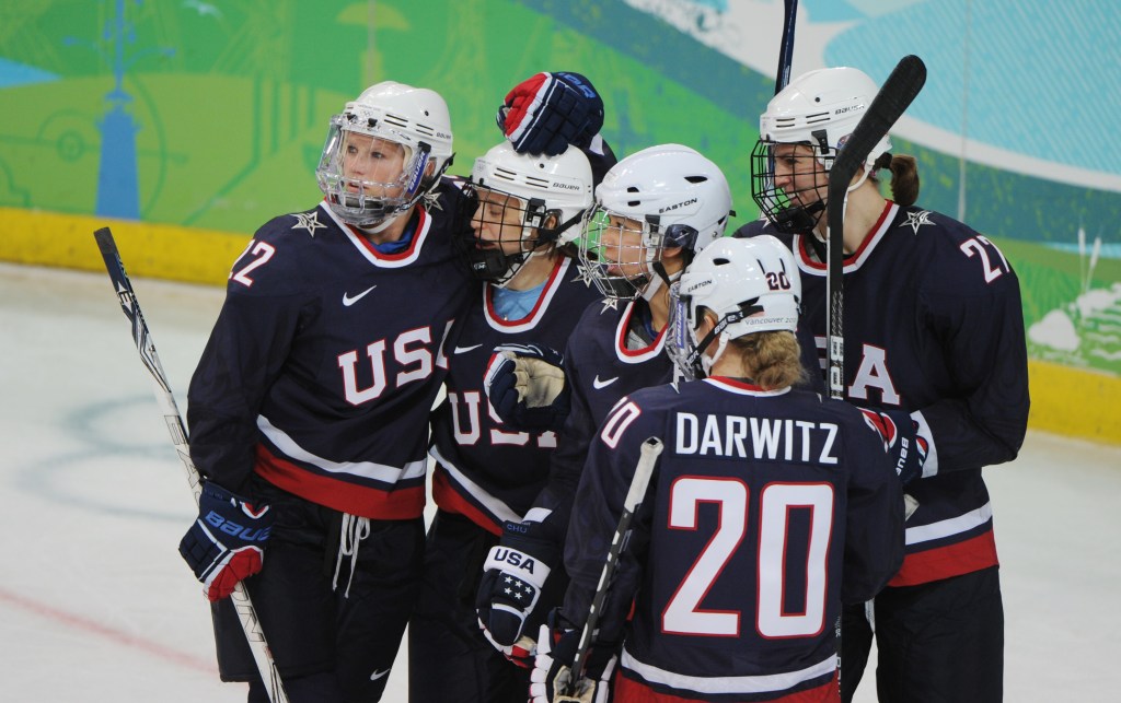 Team USA celebrates a goal scored against China during the 2010 Vancouver Winter Olympics.