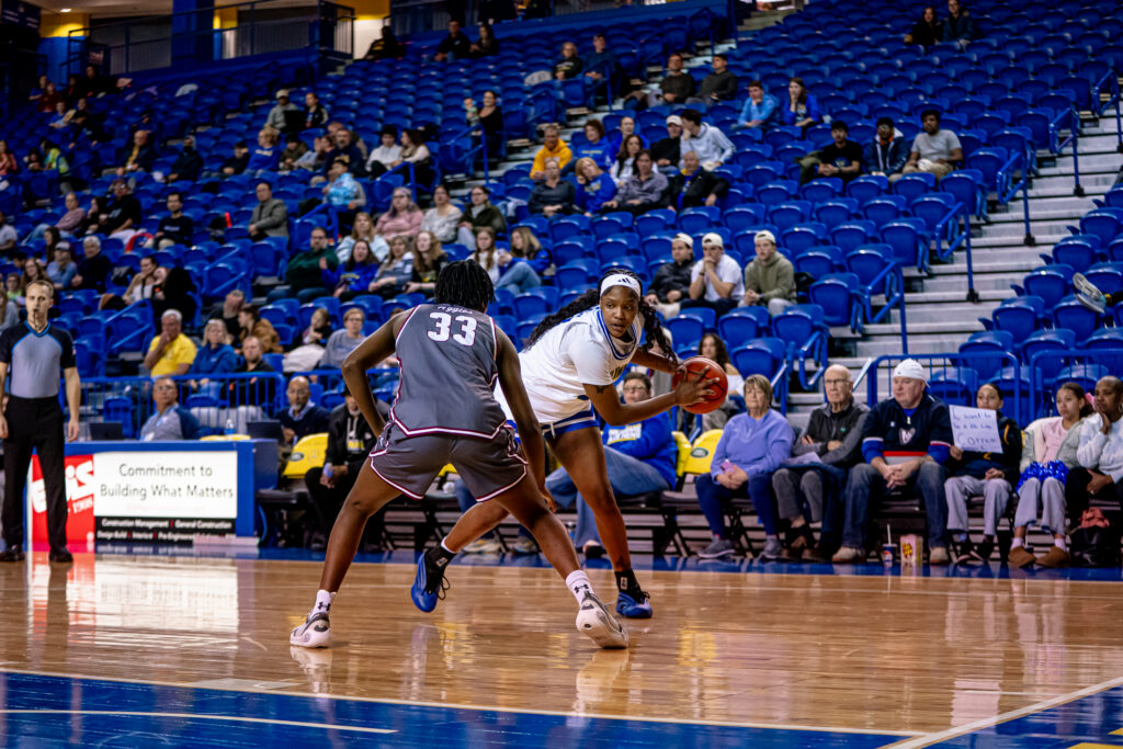 Delaware's Ande'a Cherisier looks for room to operate in a recent game against New Mexico State.