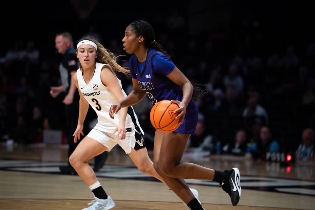 Aubrey Galvan dribbles the ball in front of a Furman defender.