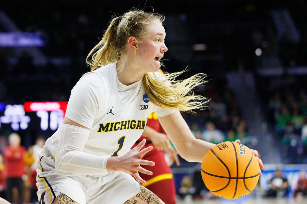Michigan guard Olivia Olson (1) grabs a rebound.