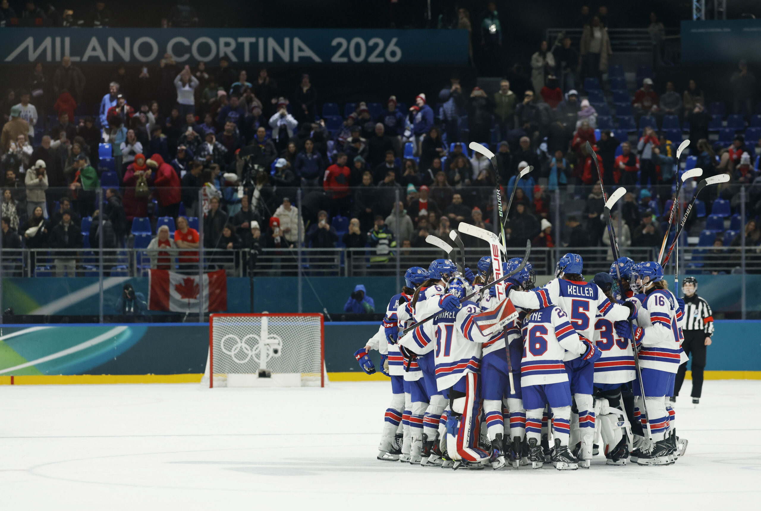 United States players celebrate together on the ice