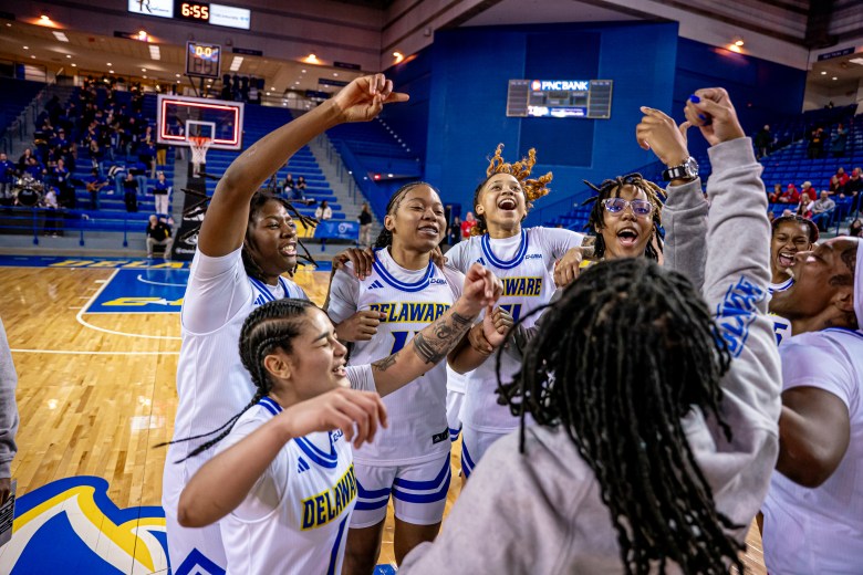 Delaware players celebrate their first Conference USA win over Liberty.