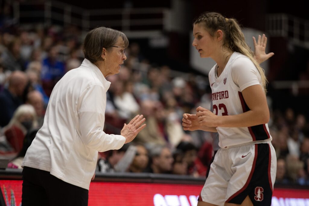 Hannah Jump chats with Tara VanDerveer on the sideline.
