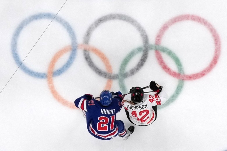 In an aerial photograph, Hilary Knight and Claire Thompson compete for the puck