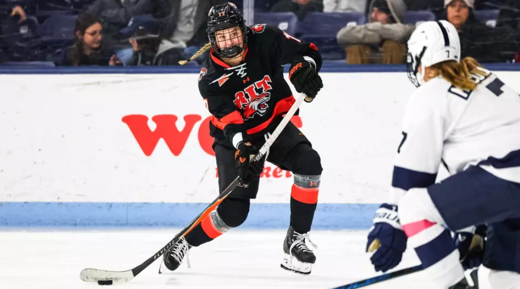 Katie DeSa controls the puck in front of her goal.