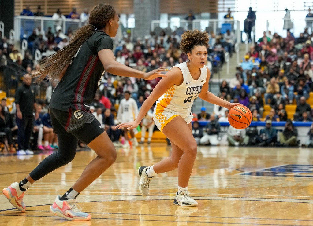 Coppin State's Sydney Burris is being guard by a South Carolina player in a game on Jan. 18 in Baltimore.