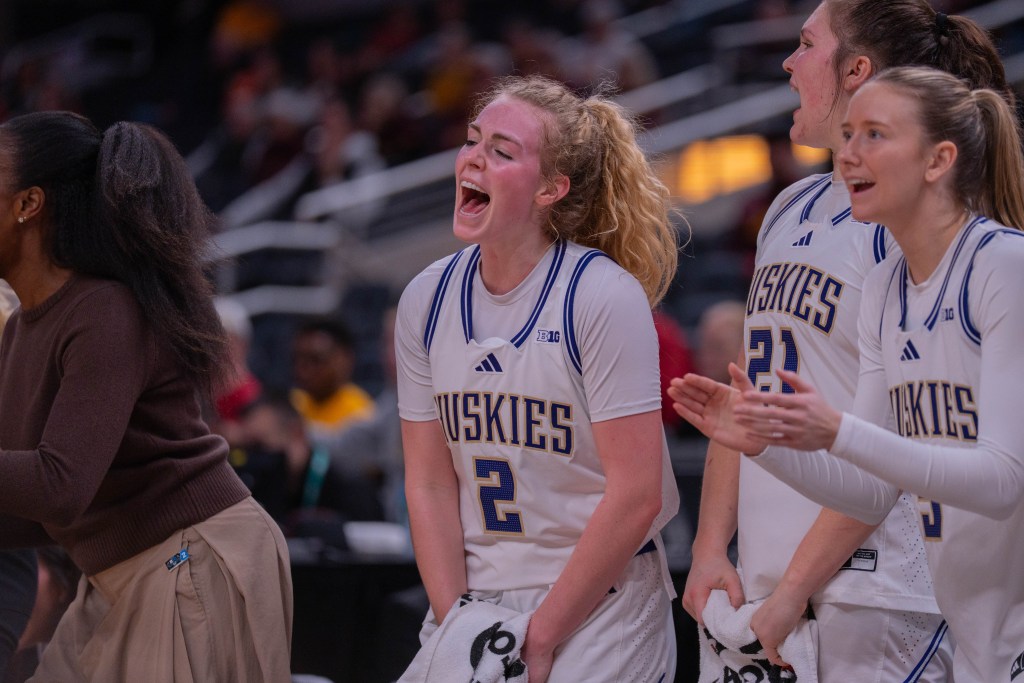 Washington guard Avery Howell yells in celebration on the bench during a Big Ten Tournament game against USC on March 5, 2026, at Gainbridge Fieldhouse in Indianapolis, Ind.