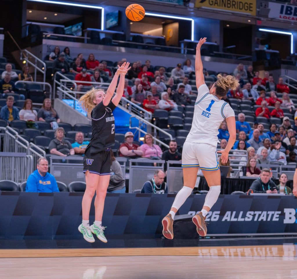 Washington guard Avery Howell shoots a three-pointer over UCLA guard Kiki Rice in a Big Ten Tournament game on March 6, 2026, at Gainbridge Fieldhouse in Indianapolis, Ind.