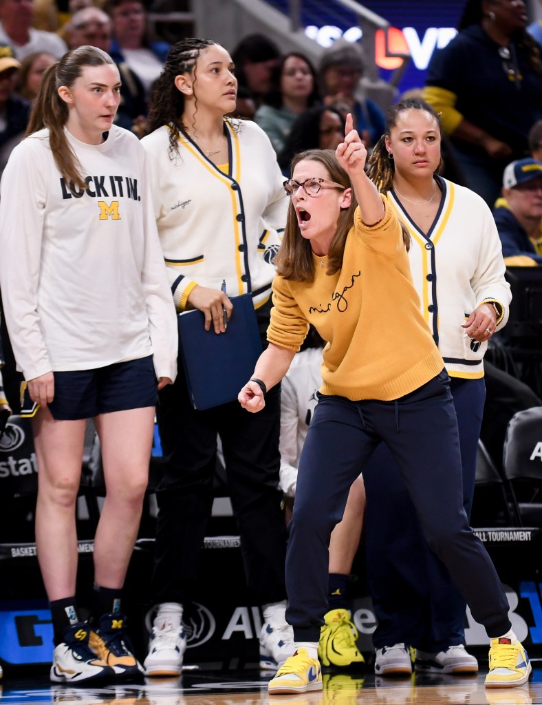 Michigan head coach Kim Barnes Arico shouts instructions during the 2026 Big Ten Tournament from the sidelines.