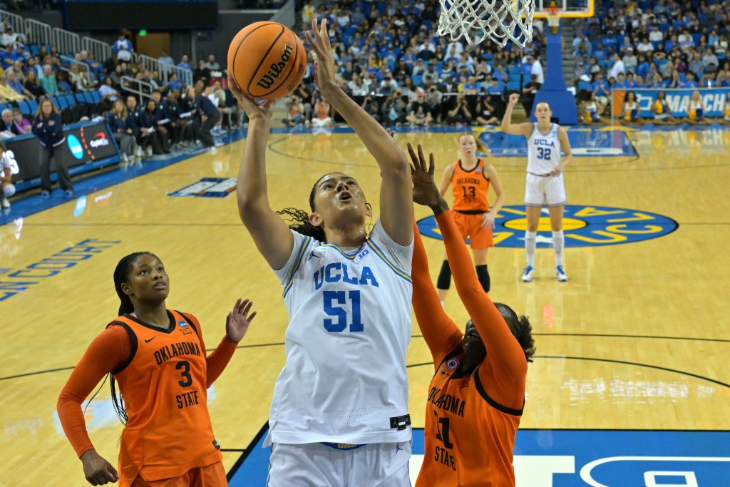 UCLA senior Lauren Betts shoots over two Oklahoma State defenders during the Round of 32 game in the 2026 NCAA Tournament.