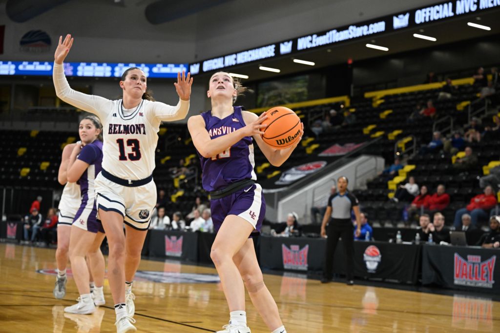 Evansville guard Camryn Runner goes up for a shot against Belmont's Avery Strickland at the 2026 Missouri Valley Tournament at XTream Arena in Coralville, Iowa.