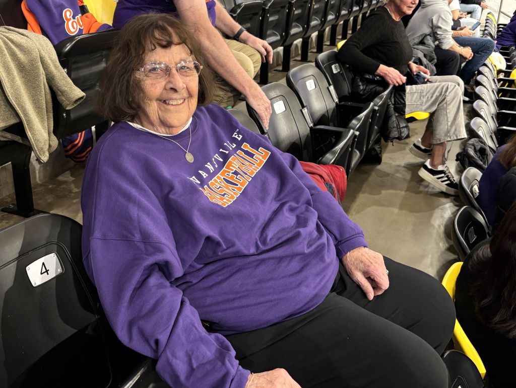 Donna Frese, mother of Maryland head coach Brenda Frese, watches her granddaughter play basketball from the stands