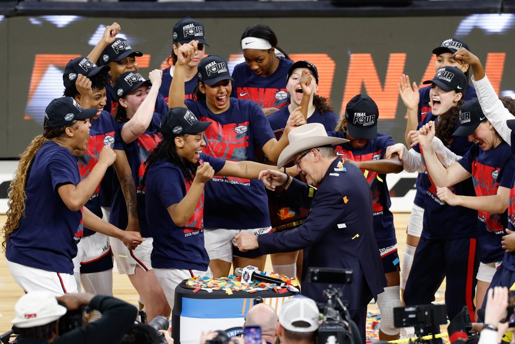 UConn celebrates their win over Notre Dame at the Elite 8 of the 2026 NCAA Tournament.