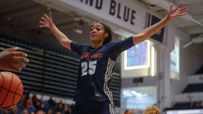 Nile Miller prepares to play defense for Howard with her arms outstretched.