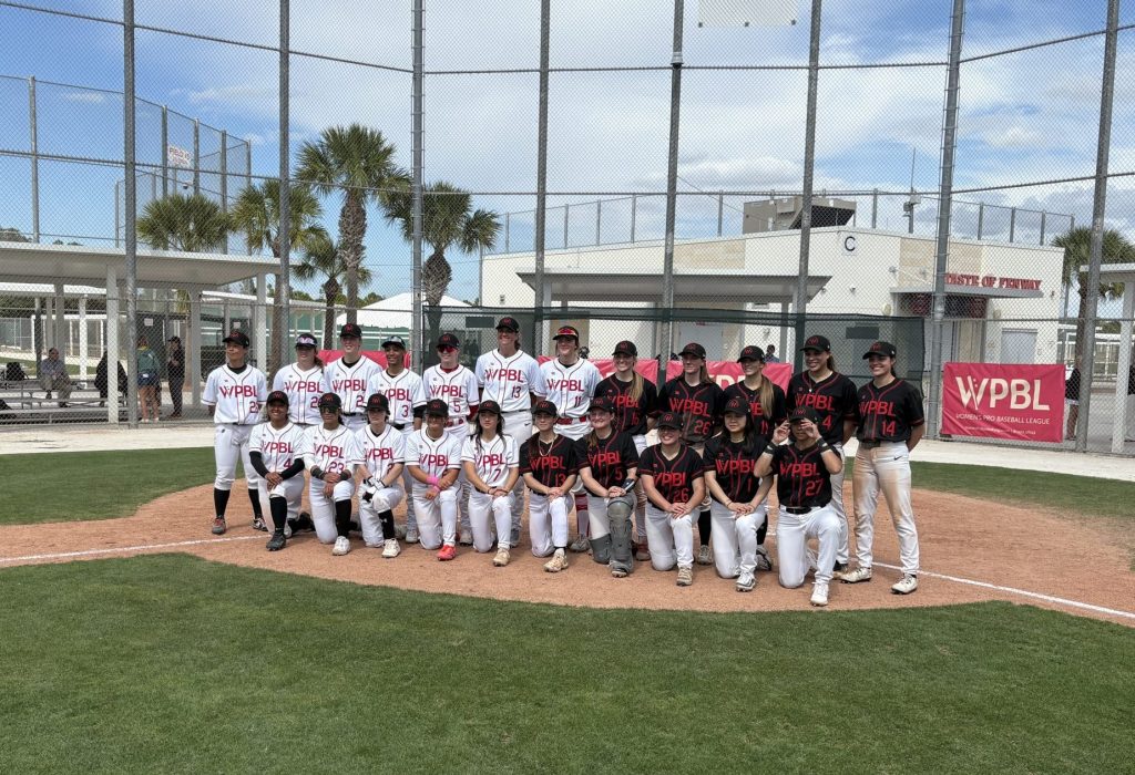 WPBL players pose at home plate after first spring training game.