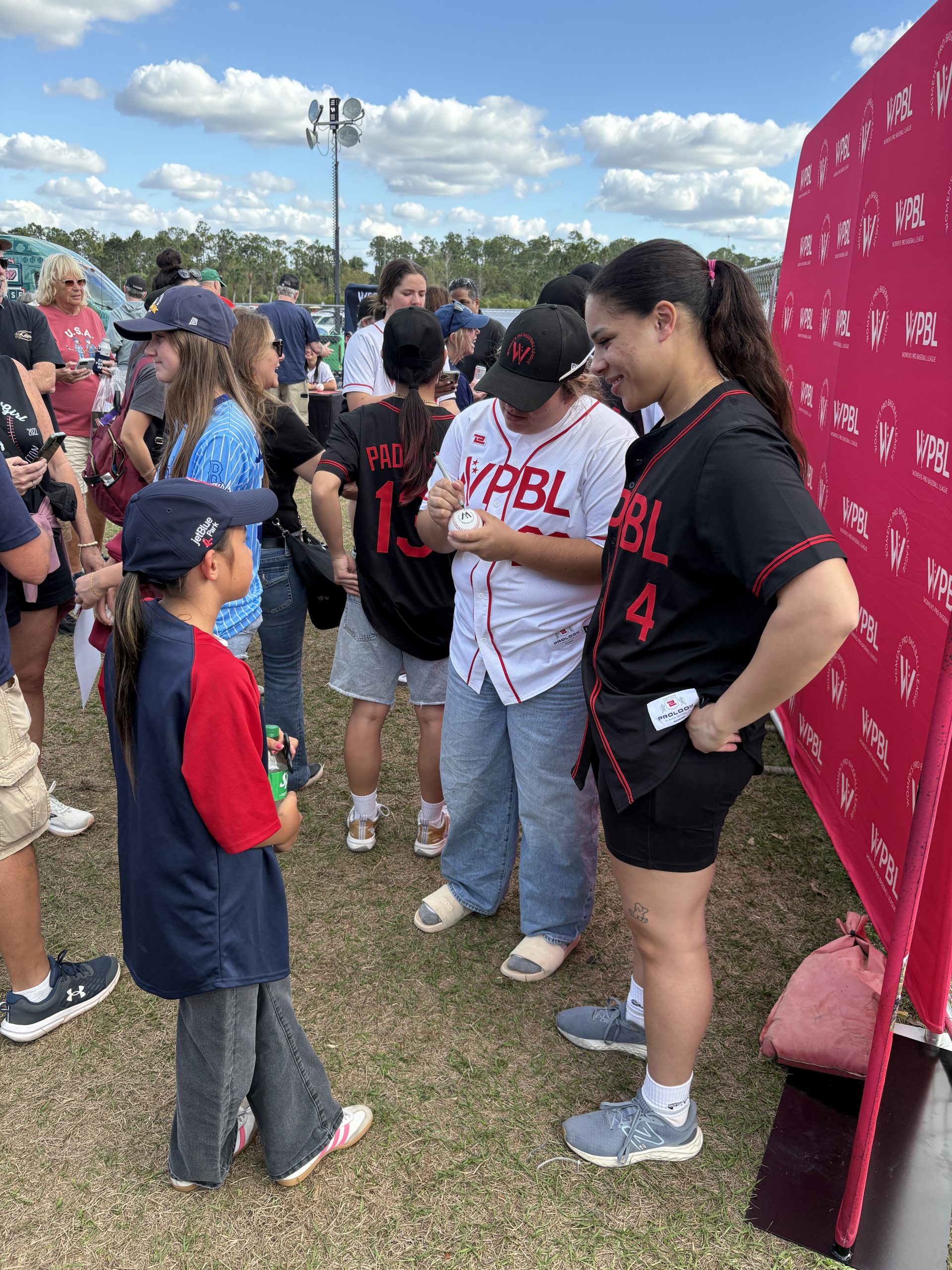 Sabrina Robinson and Andréanne Leblanc speak to a young fan.