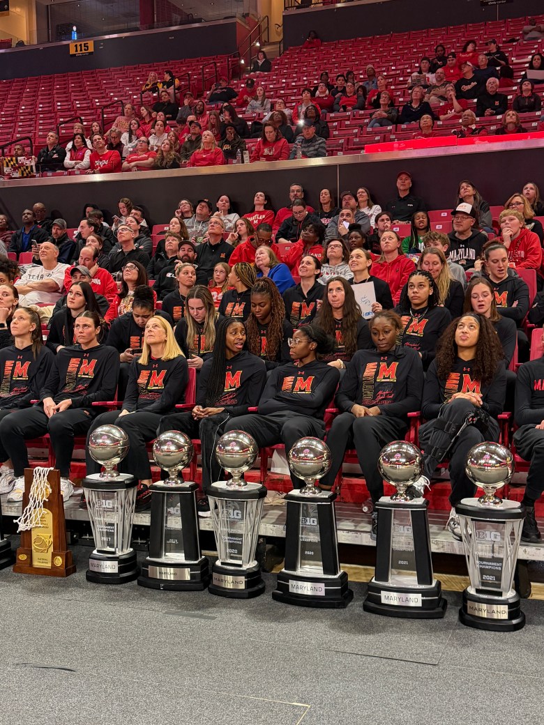 Players looking up at a scoreboard.