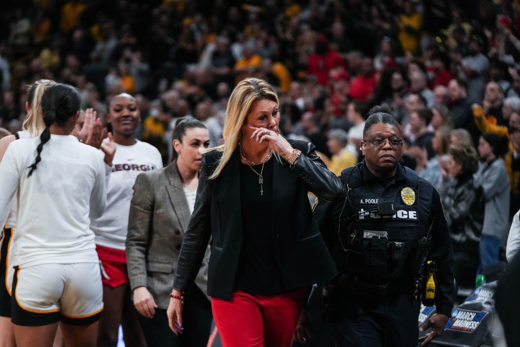Georgia head coach Katie Abrahamson-Henderson wipes away a tear as she walks off the court after a loss in the NCAA Tournament.