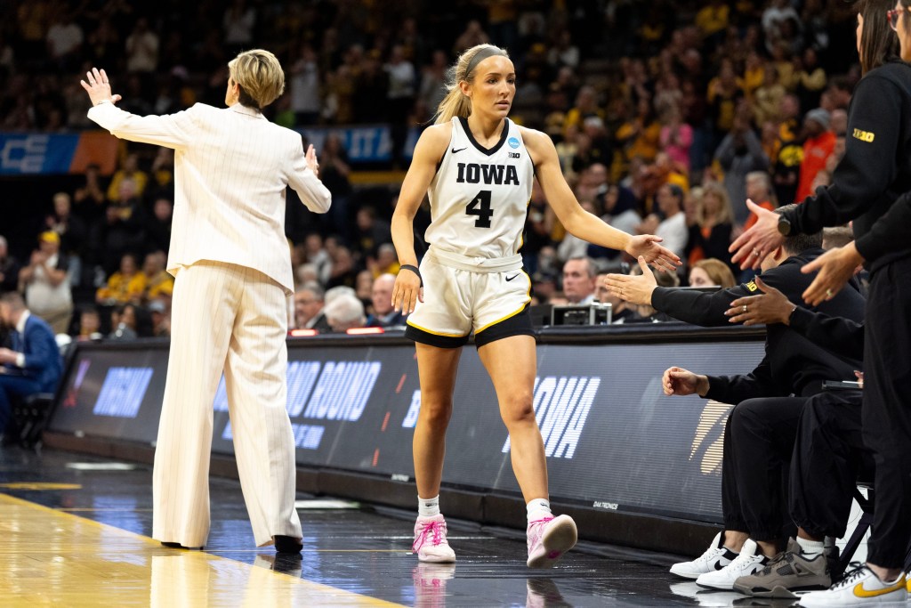 Iowa guard Kylie Feuerbach checks out of the game after fouling out in a double overtime loss to the Virginia Cavaliers at Carver-Hawkeye Arena in Iowa City, Iowa. 
