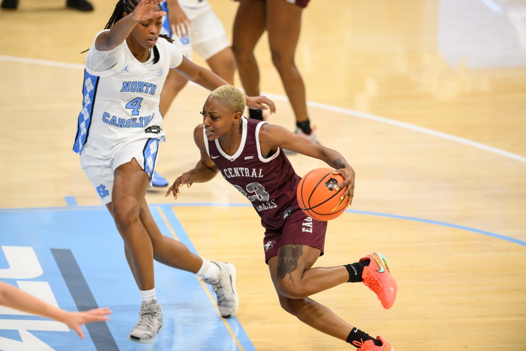 North Carolina Central's Najah Lane drives past a North Carolina guard in a game early in the 2025-26 season.