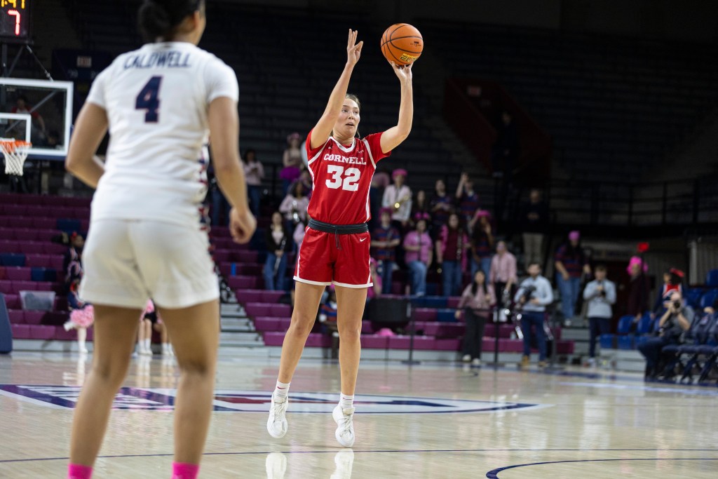 Cornell forward Emily Pape shoots a left-handed 3-pointer. She is wide open, with no defender closing out on her.