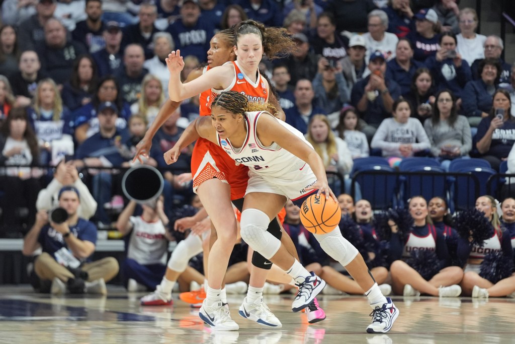 Sarah Strong of UConn dribbles past a defender from Syracuse in the Round of 32 matchup of the 2026 NCAA Tournament played in Storrs, CT.