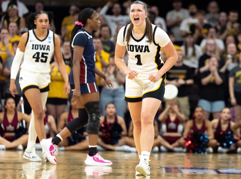 Iowa guard Taylor Stremlow yells and pumps her fists while Hannah Stuelke looks onduring a First Round 2026 NCAA Tournament game against the Fairleigh Dickinson Knights at Carver-Hawkeye Arena in Iowa City.