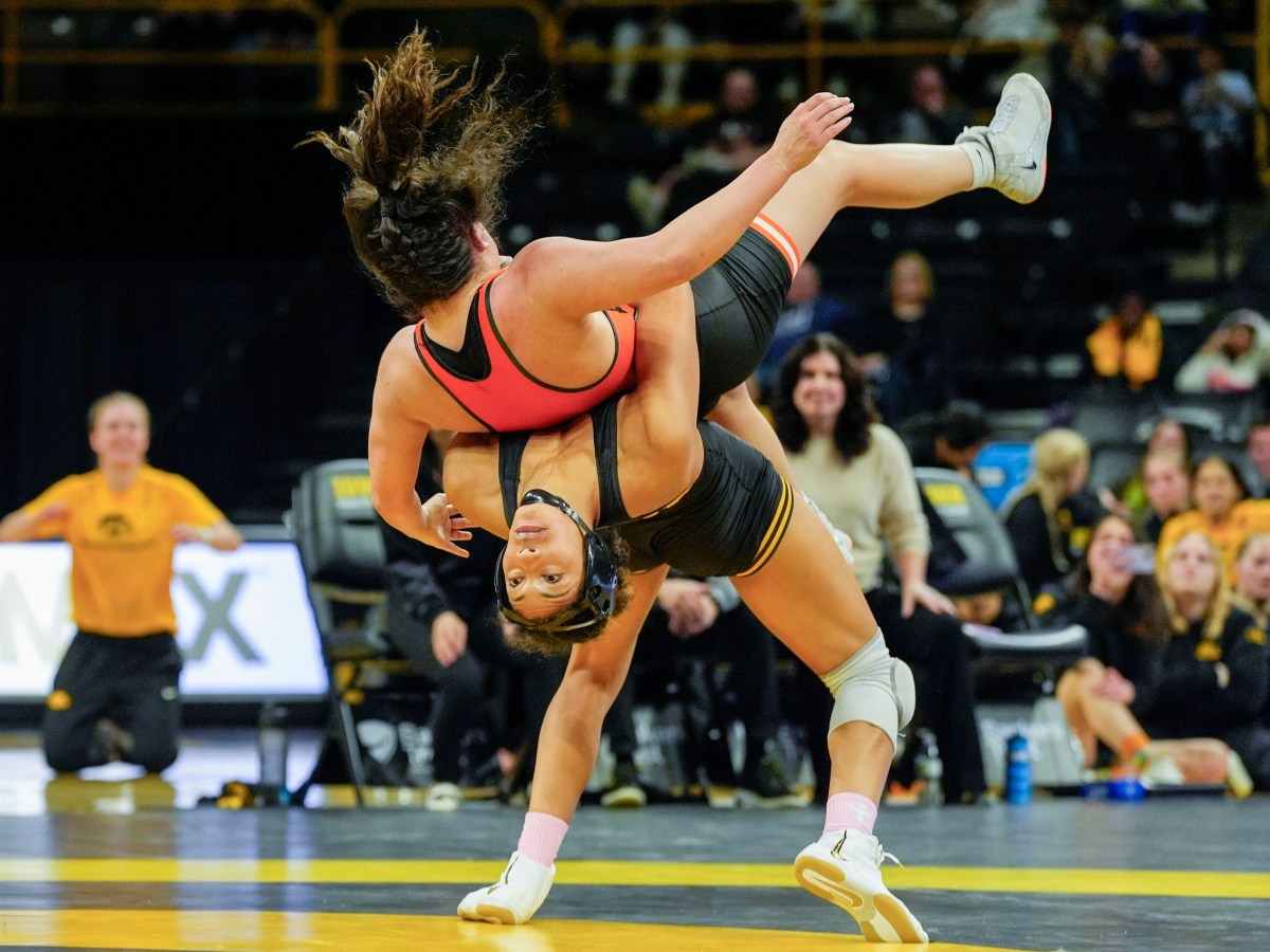Iowa’s Kennedy Blades throws Oklahoma State’s Daniella Nugent during a 160-pound match Dec. 7, 2025 at Carver-Hawkeye Arena in Iowa City, Iowa.