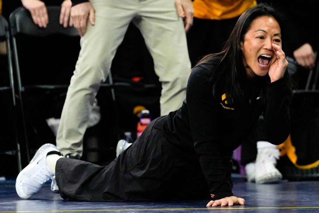 Iowa women's wrestling head coach Clarissa Chun yells out instructions Jan. 10, 2026 during a National Duals semifinal match at the UNI-Dome in Cedar Falls, Iowa.