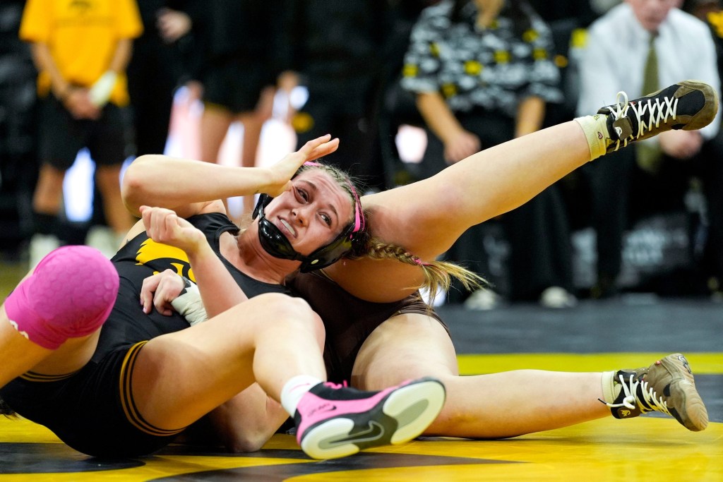 Iowa wrestler Kylie Welker throws a side roll on Lehigh’s Genevieve An in a 180-pound match Jan. 18, 2026 at Carver-Hawkeye Arena in Iowa City, Iowa.