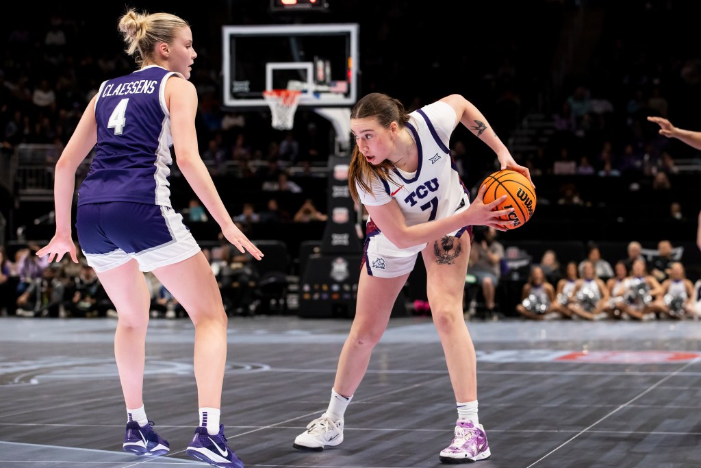 TCU Horned Frogs forward Marta Suárez prepares to maneuver around Kansas State Wildcats forward Nastja Claessens.
